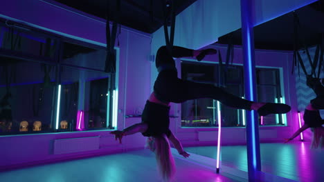 Woman-hanging-upside-down-and-using-yoga-hammock-swing-while-doing-antigravity-yoga-exercise.-Back-view-of-beautiful-young-woman-using-hammock-for-doing-pose-of-antigravity-yoga